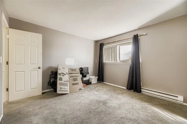 an empty room with furniture and closet