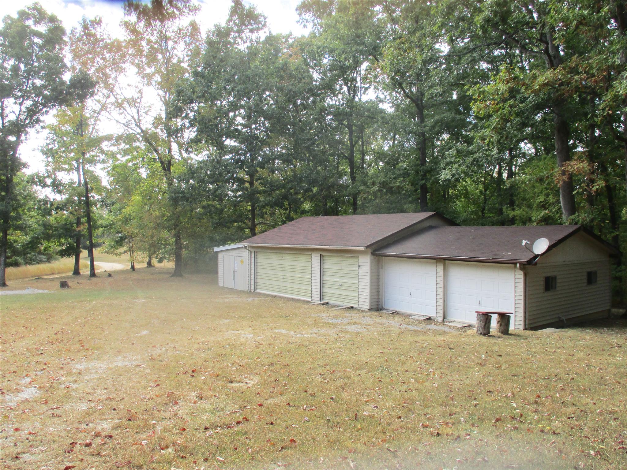 1073 West Point Road Lawrenceburg, TN 38464 - Photo 12 of 24 a house with trees in front of it