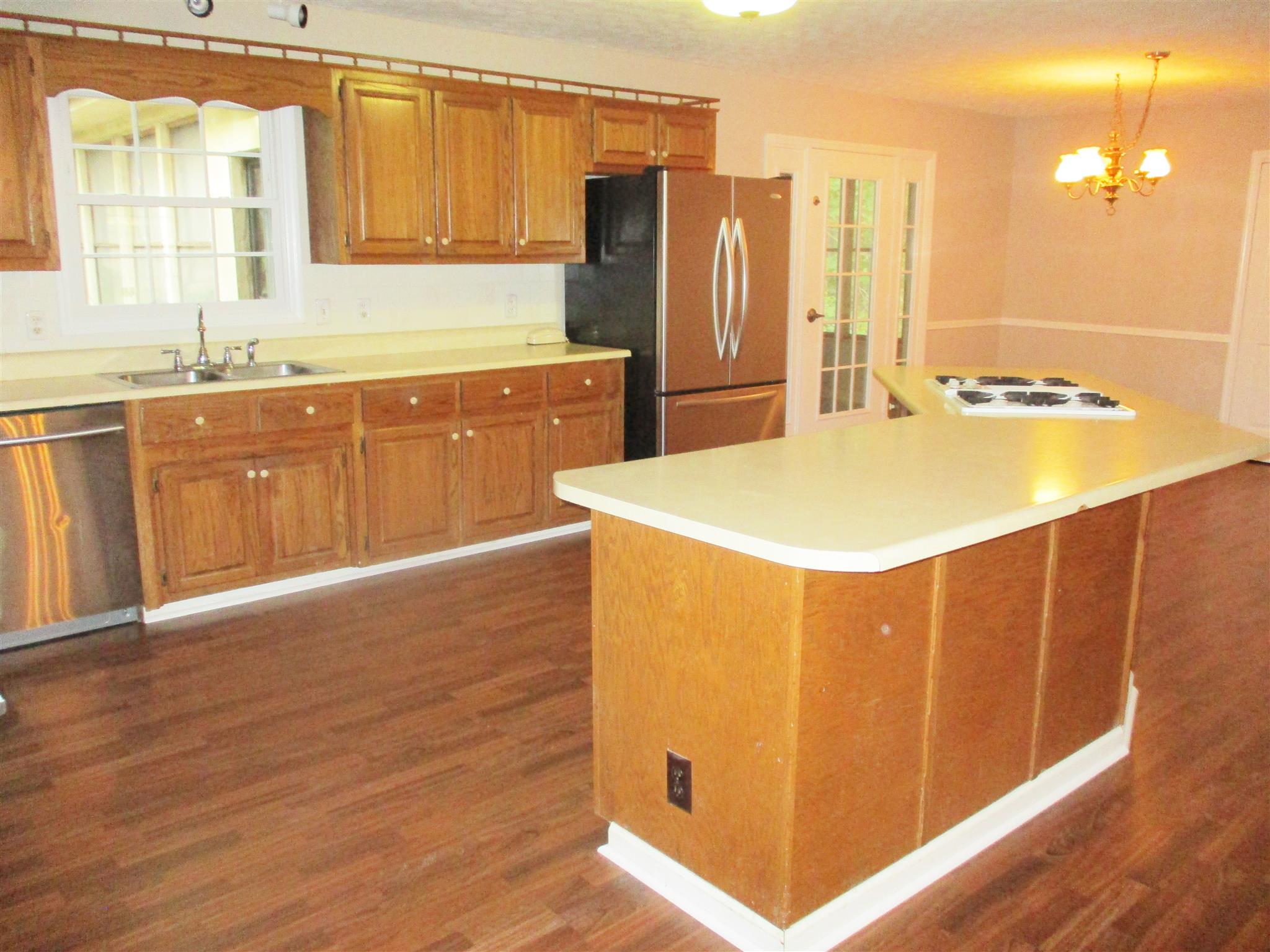 1073 West Point Road Lawrenceburg, TN 38464 - Photo 16 of 24 a kitchen with stainless steel appliances a refrigerator and a sink