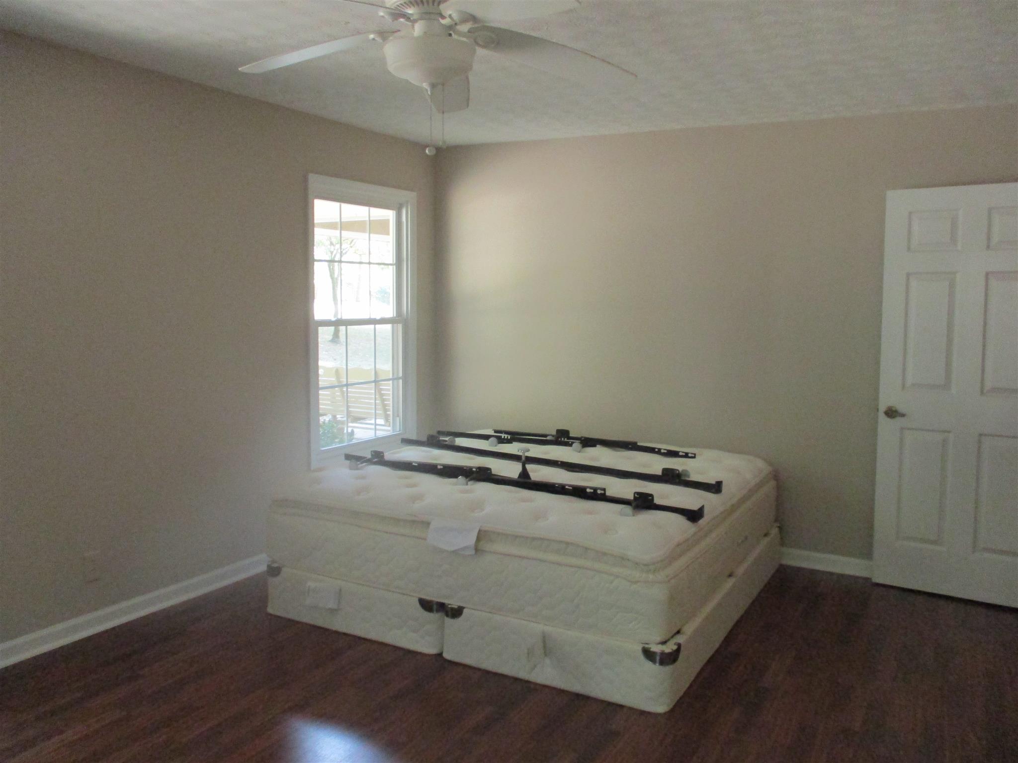 1073 West Point Road Lawrenceburg, TN 38464 - Photo 19 of 24 an empty room with wooden floor
