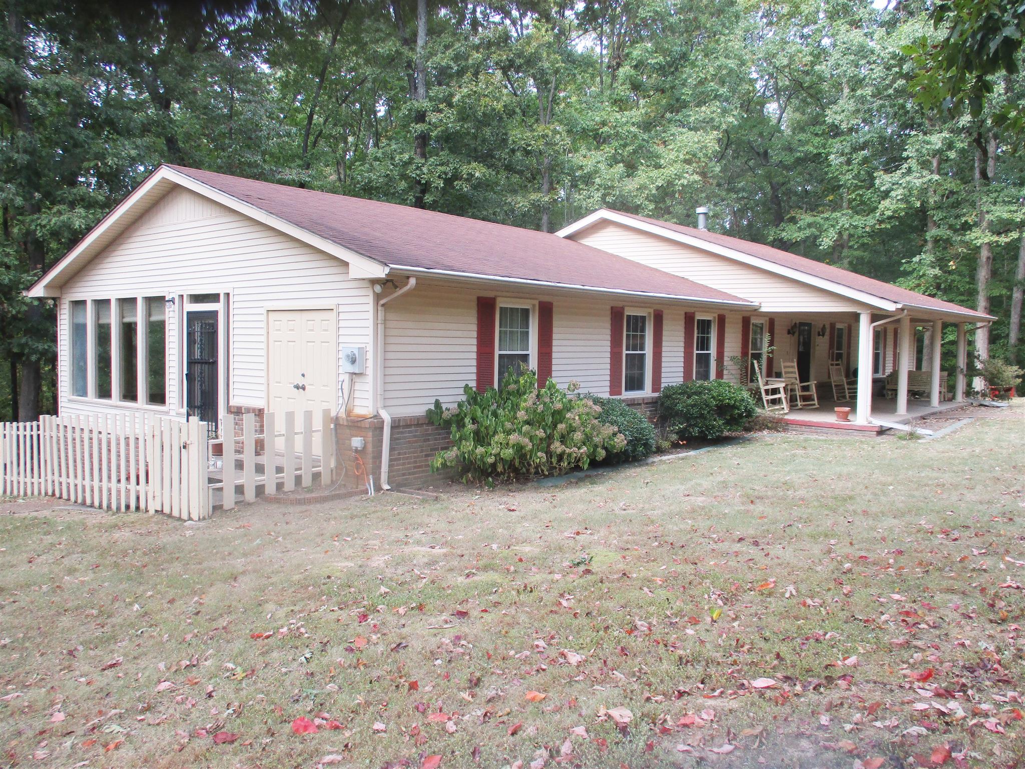 1073 West Point Road Lawrenceburg, TN 38464 - Photo 3 of 24 a view of a house with a yard and potted plants
