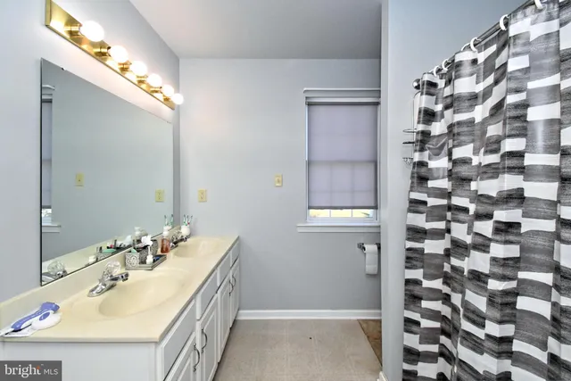 a view of room with window and flat screen tv