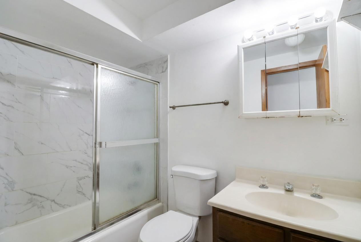 45 North McAree Road Waukegan, IL 60085 - Photo 12 of 12 a bathroom with a sink toilet and shower