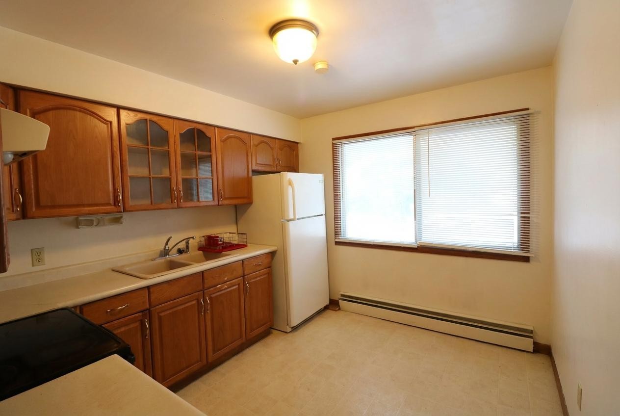 45 North McAree Road Waukegan, IL 60085 - Photo 4 of 12 a kitchen with stainless steel appliances granite countertop a stove a sink and a refrigerator