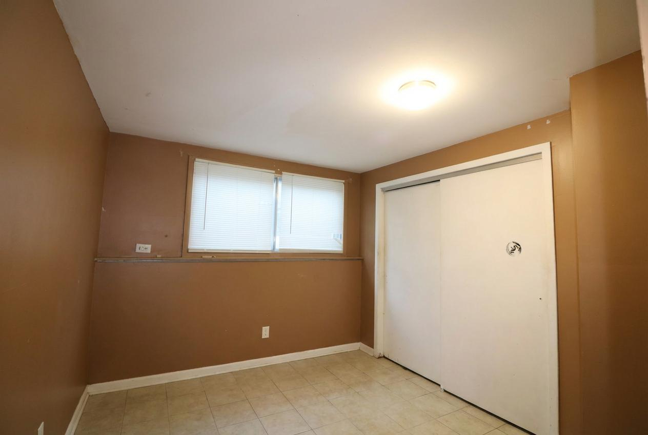 45 North McAree Road Waukegan, IL 60085 - Photo 5 of 12 a view of an empty room with a window