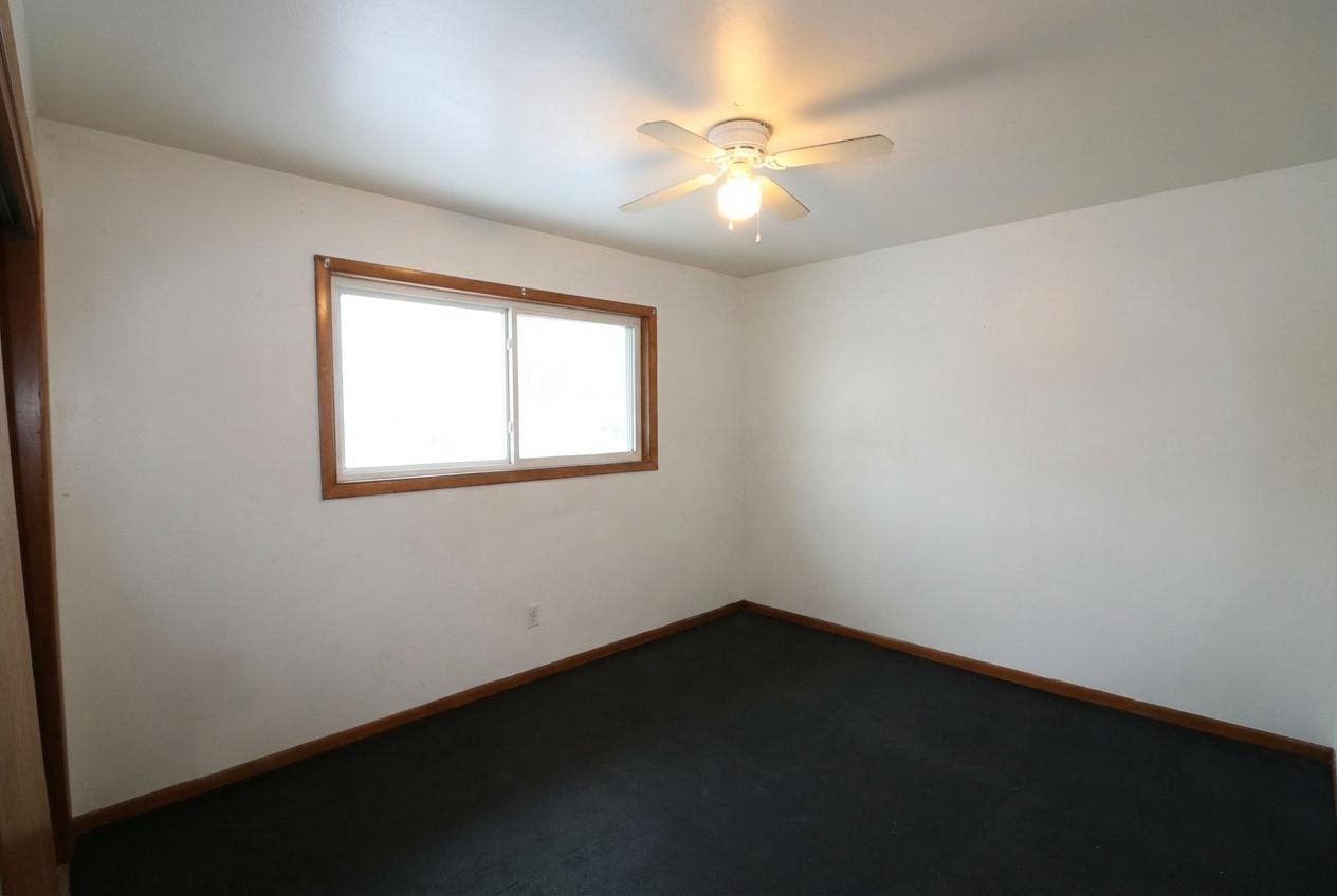 45 North McAree Road Waukegan, IL 60085 - Photo 9 of 12 wooden floor in an empty room with a window