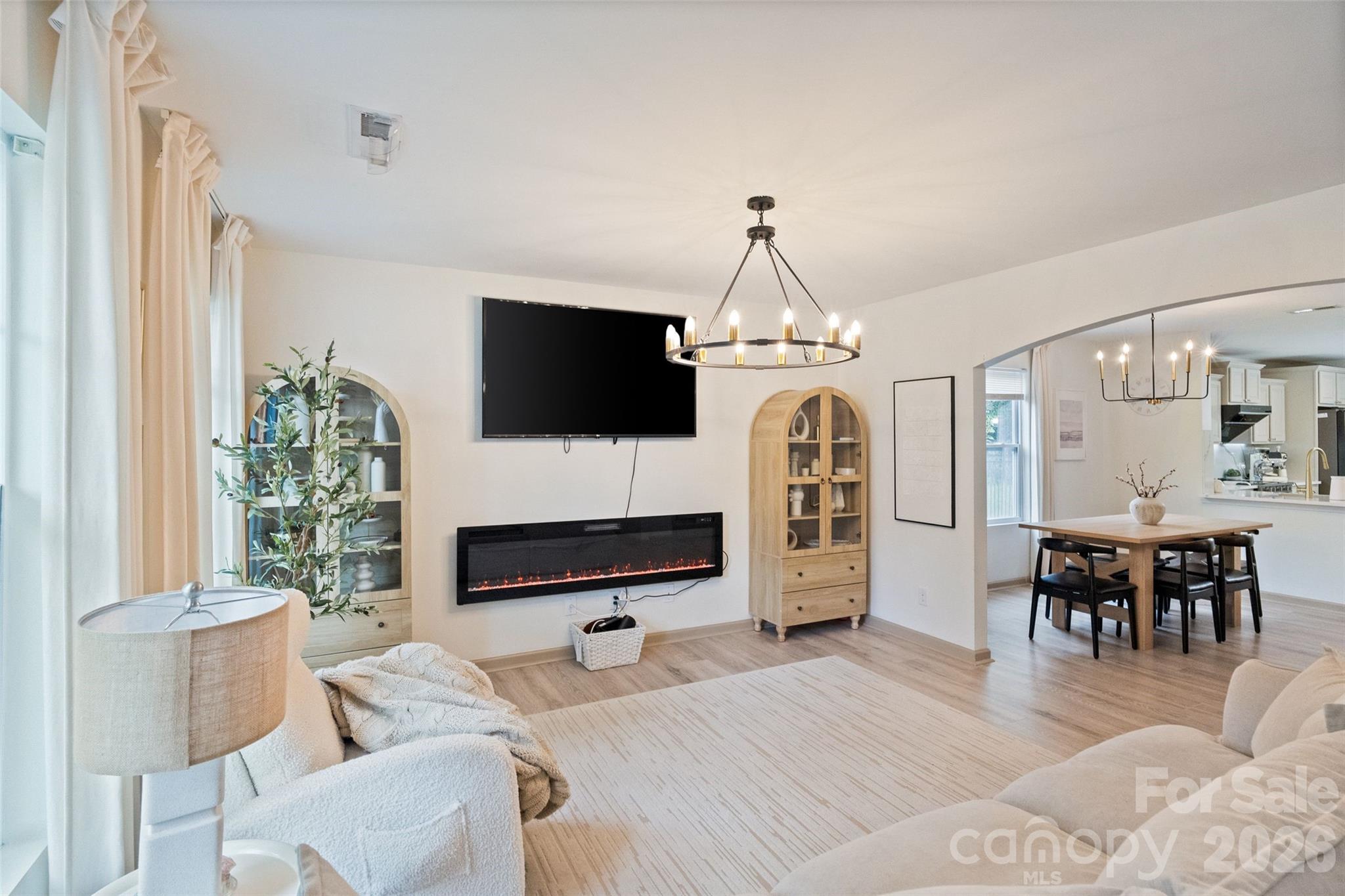 8726 Conrad Street Locust, NC 28097 - Photo 1 of 36 a living room with furniture a fireplace and a flat screen tv