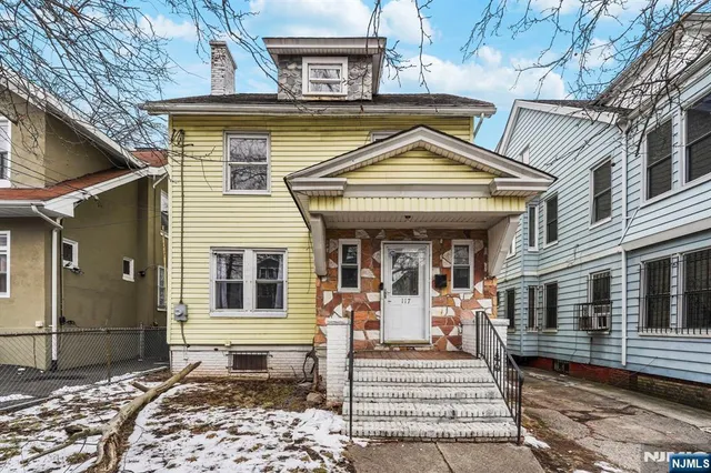 a view of a house with entrance gate