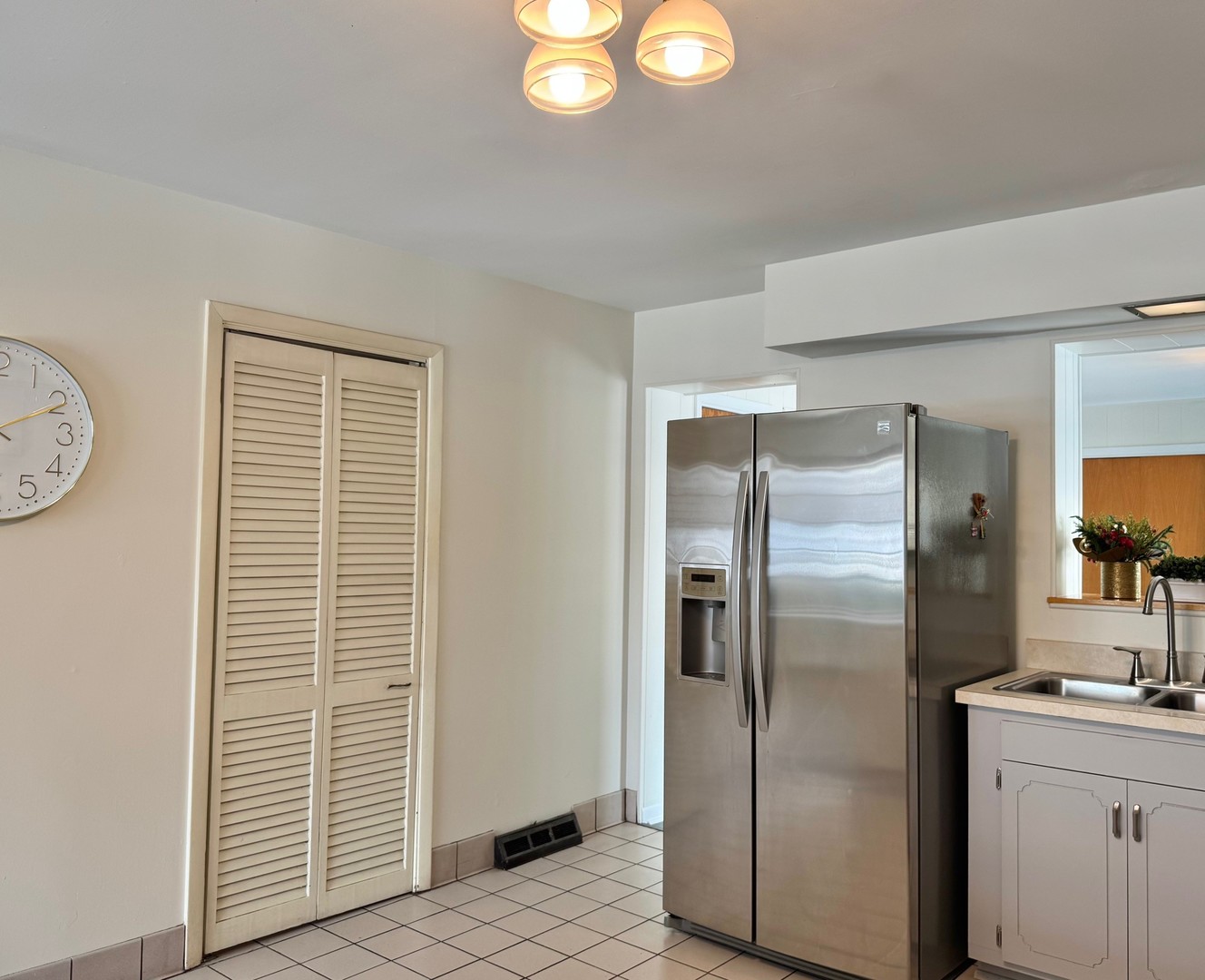 3051 South Scott Street Des Plaines, IL 60018 - Photo 12 of 43 a kitchen with a refrigerator and a sink