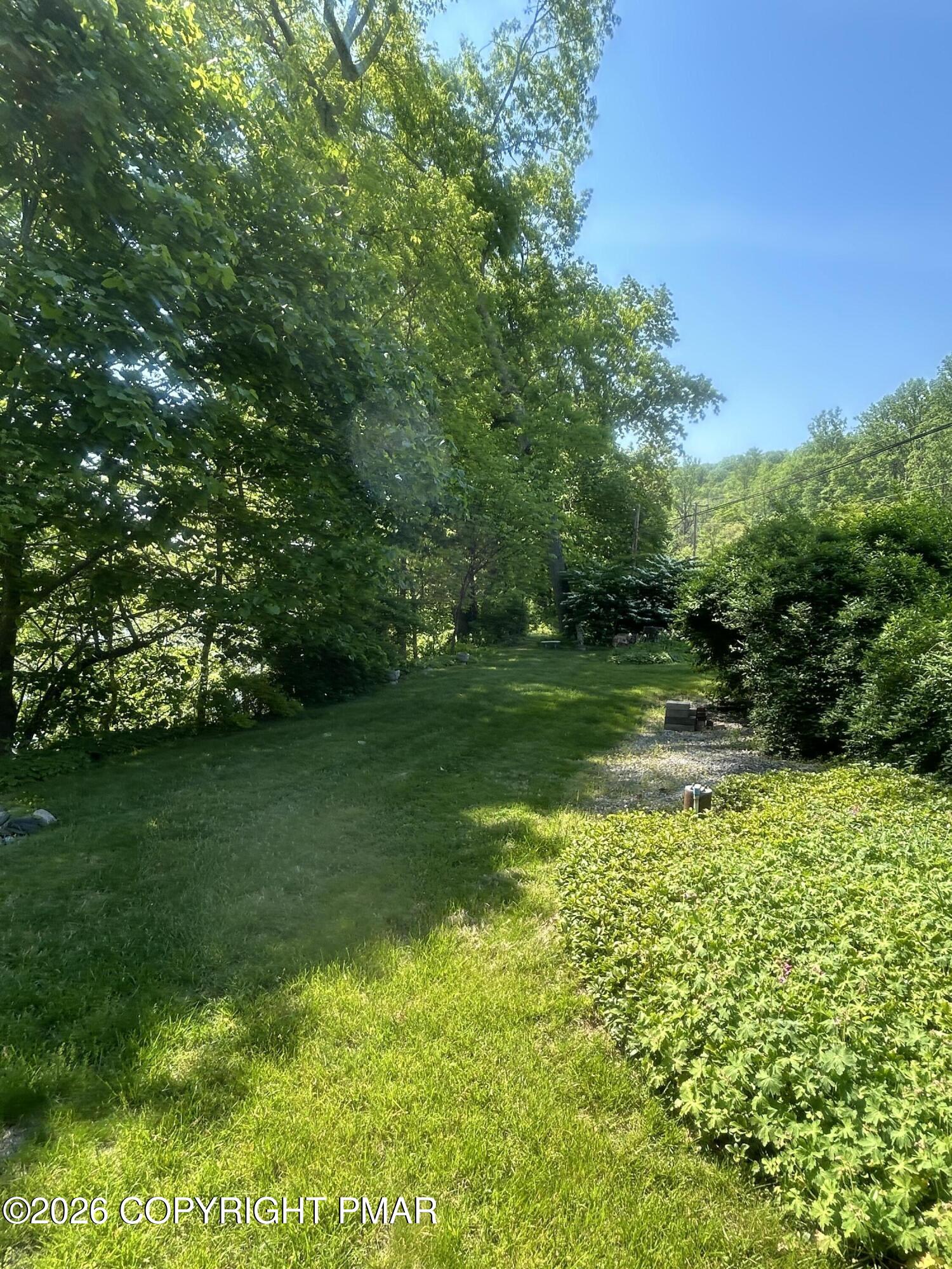 4379 River Road Mount Bethel, PA 18343 - Photo 17 of 48 a view of a garden with a lake