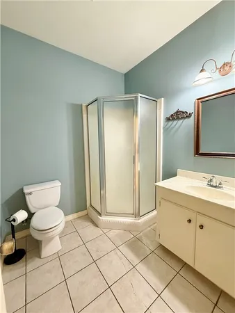 a bedroom with a bed and a ceiling fan
