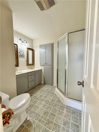 an empty room with a ceiling fan and window