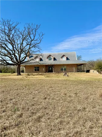 a front view of a building with mountain view