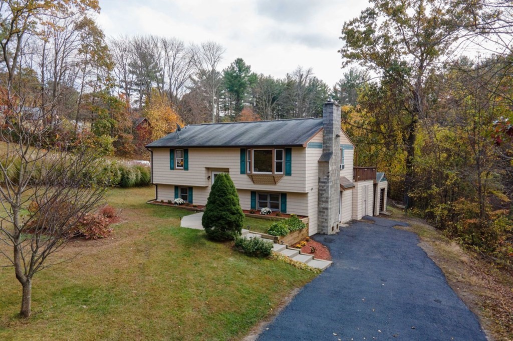 198 Lower Gore Road Webster, MA 01570 - Photo 1 of 41 a front view of a house with garden