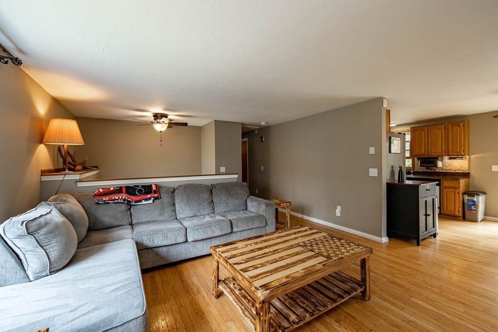 198 Lower Gore Road Webster, MA 01570 - Photo 14 of 41 a living room with furniture and wooden floor
