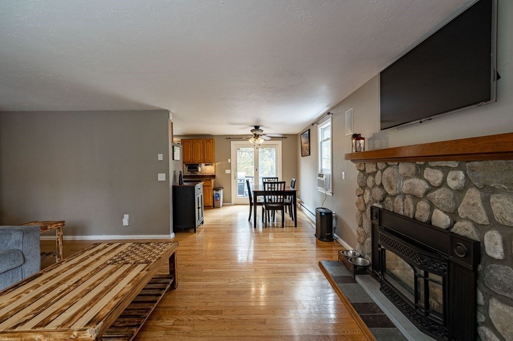 198 Lower Gore Road Webster, MA 01570 - Photo 15 of 41 a bedroom with furniture and a wooden floor