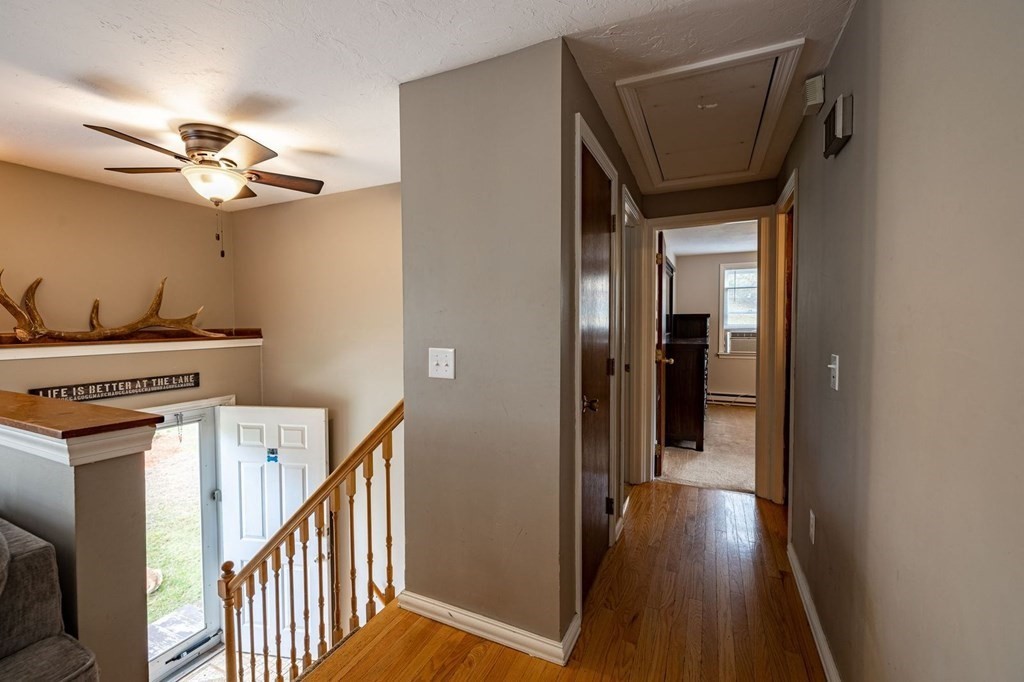 198 Lower Gore Road Webster, MA 01570 - Photo 17 of 41 a view of a hallway with wooden floor