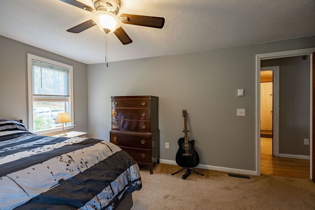198 Lower Gore Road Webster, MA 01570 - Photo 19 of 41 a bedroom with a bed and a ceiling fan
