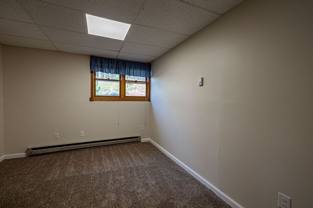 198 Lower Gore Road Webster, MA 01570 - Photo 31 of 41 an empty room with a window