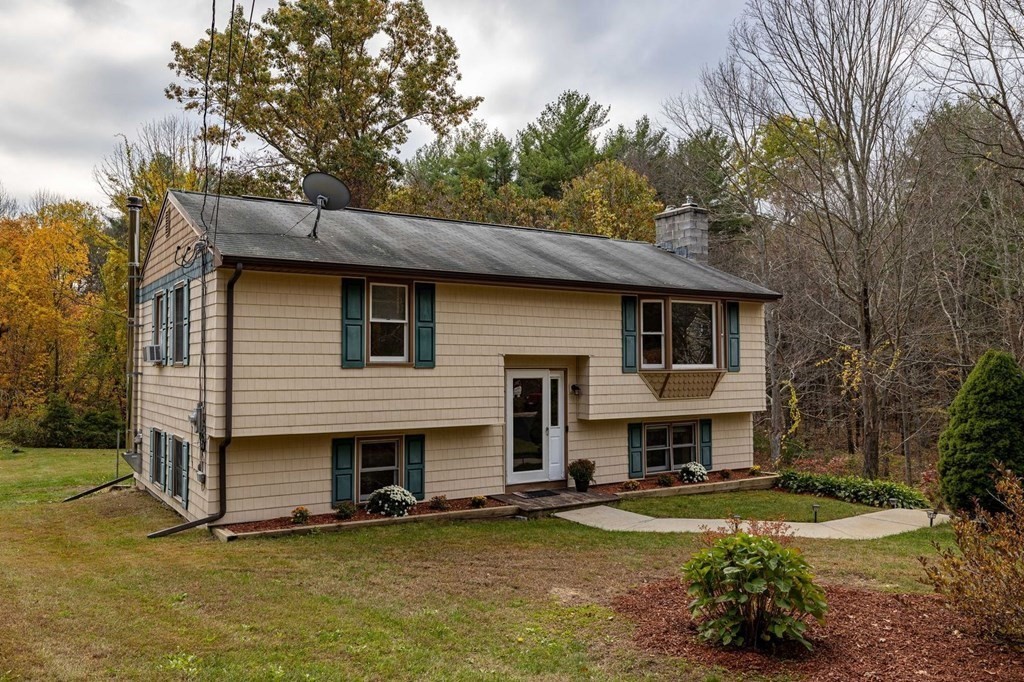 198 Lower Gore Road Webster, MA 01570 - Photo 6 of 41 a front view of a house with yard outdoor seating and barbeque oven
