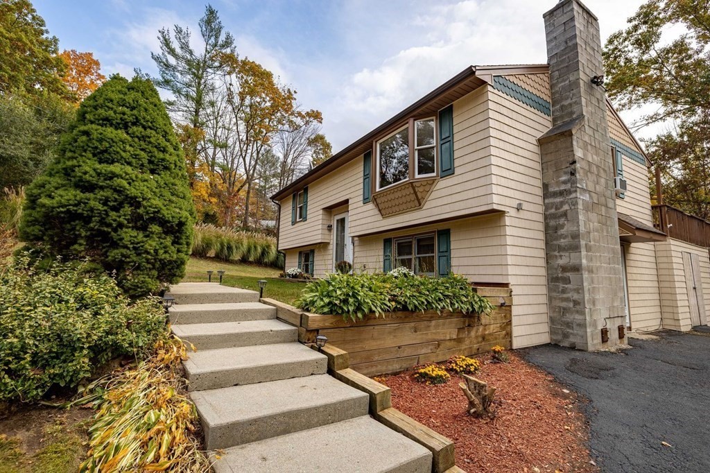 198 Lower Gore Road Webster, MA 01570 - Photo 8 of 41 a front view of a house with a yard