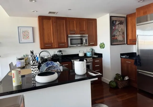 a kitchen with a sink and a stove top oven