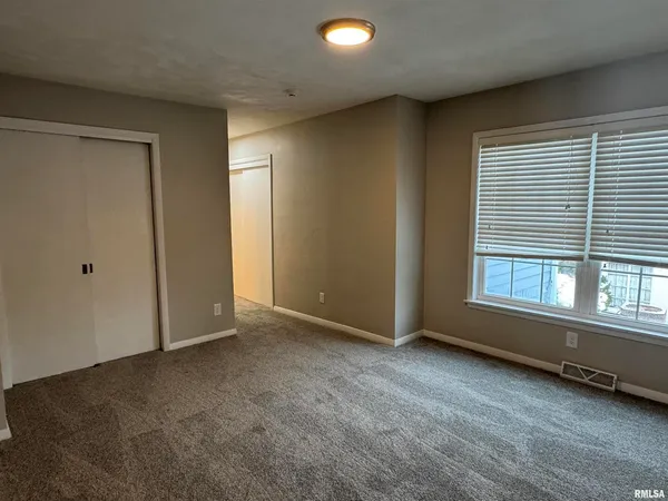 a view of hallway with closet