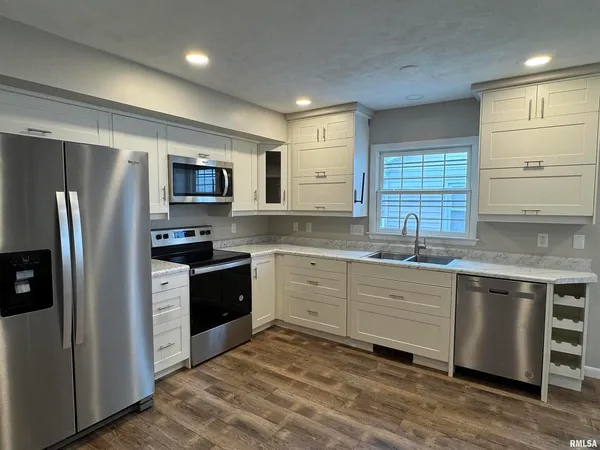 a kitchen with a sink and cabinets