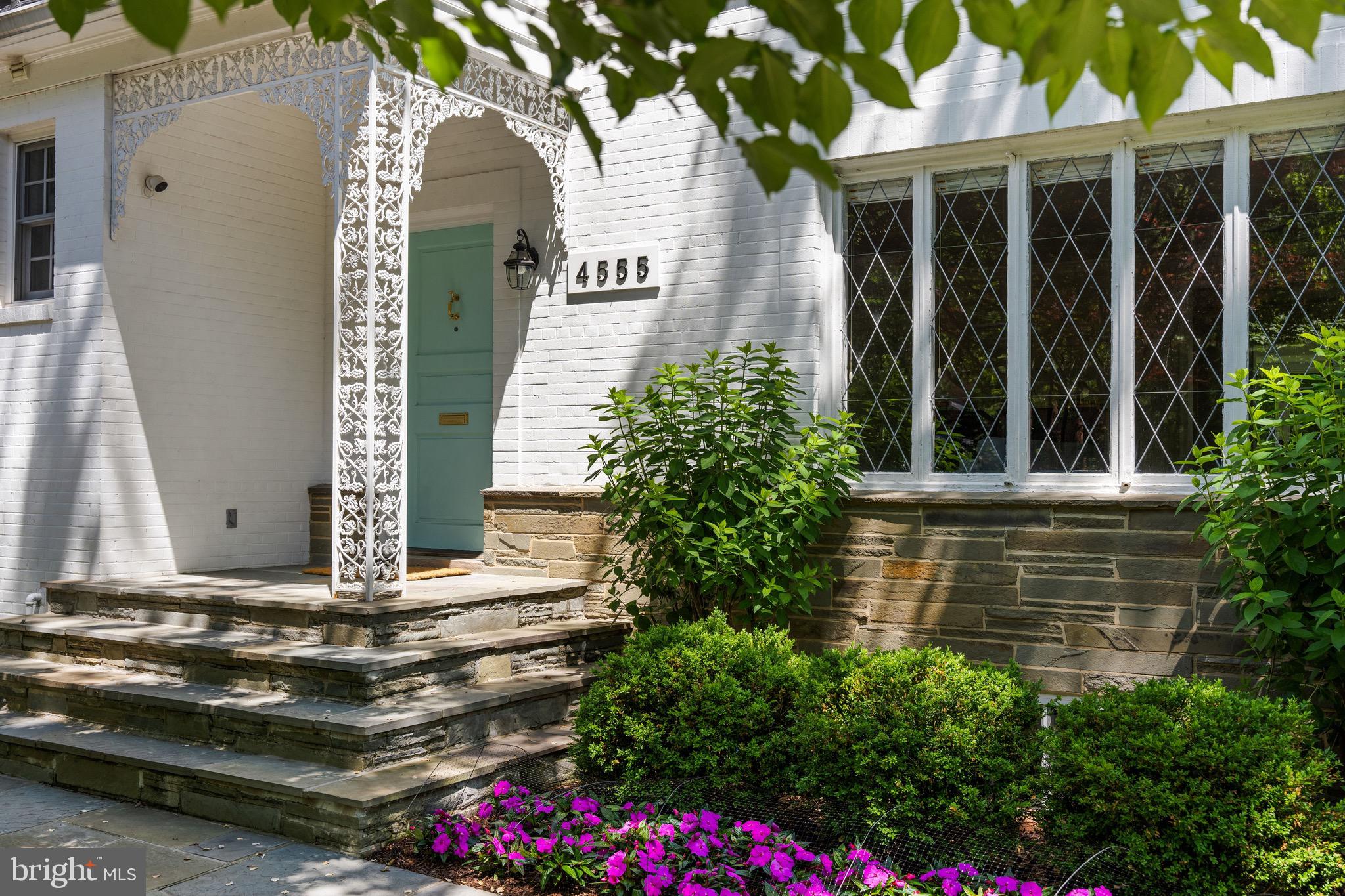4555 W Street Northwest Washington, DC 20007 - Photo 2 of 34 a front view of a house with a yard