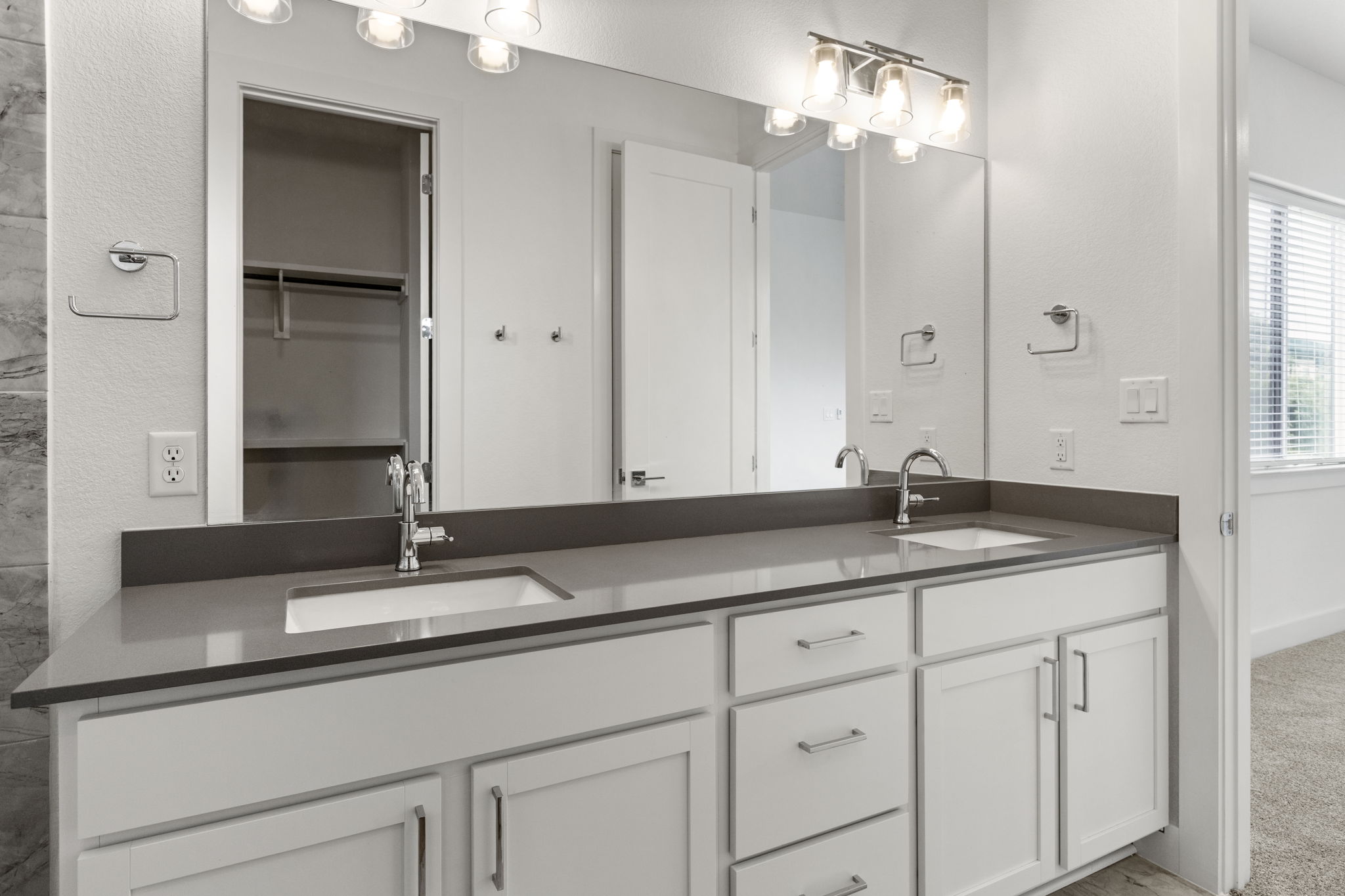 2050 Lohmans Spur Road, Unit 2005 Lakeway, TX 78734 - Photo 11 of 36 2050 Lohmans Spur #2005 - the primary bathroom features a large double vanity, walk-in shower, and walk-in closet.