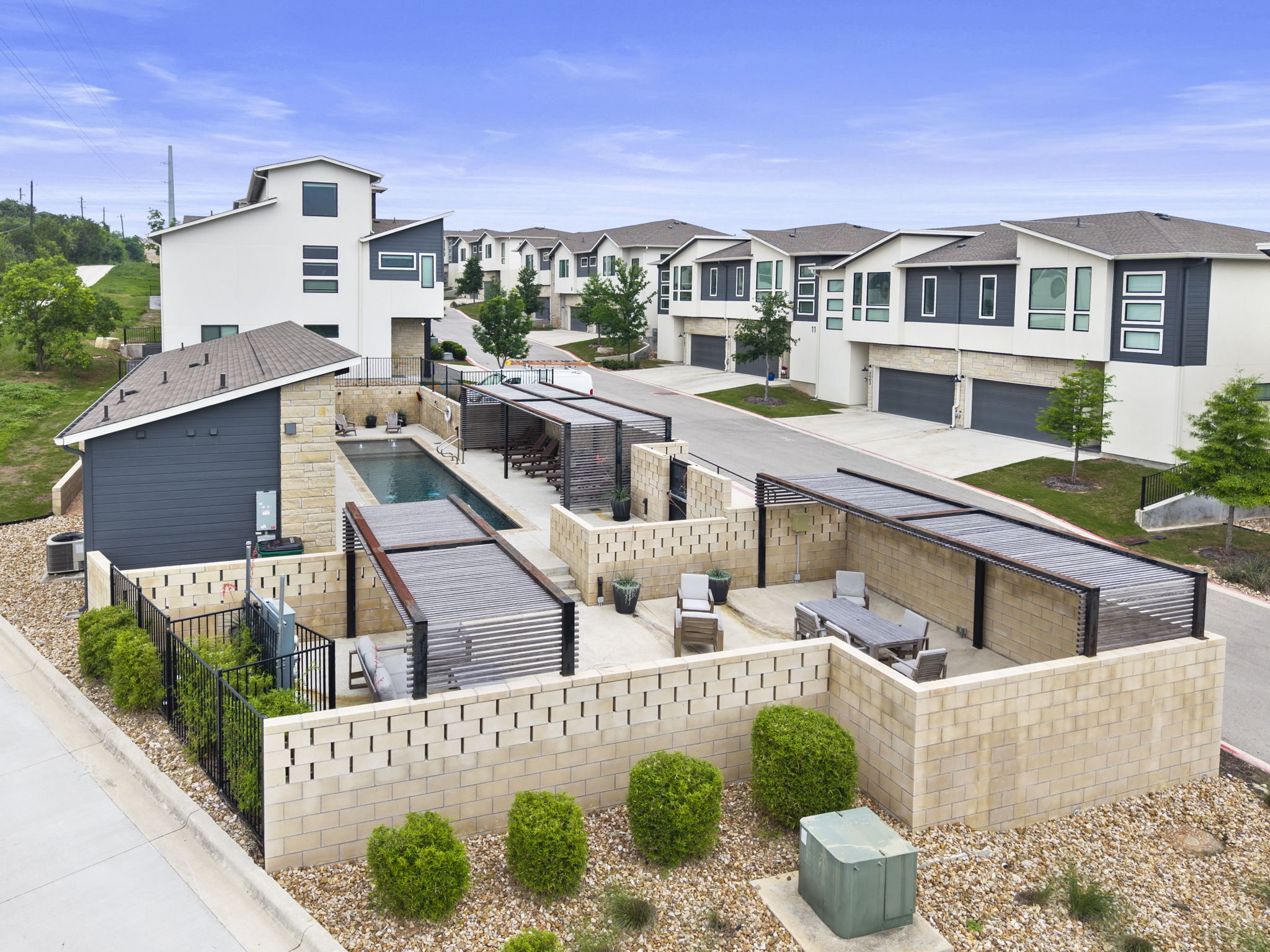 2050 Lohmans Spur Road, Unit 2005 Lakeway, TX 78734 - Photo 20 of 36 The amenity center features a private pool, outdoor kitchen, lounge areas, and gym.
