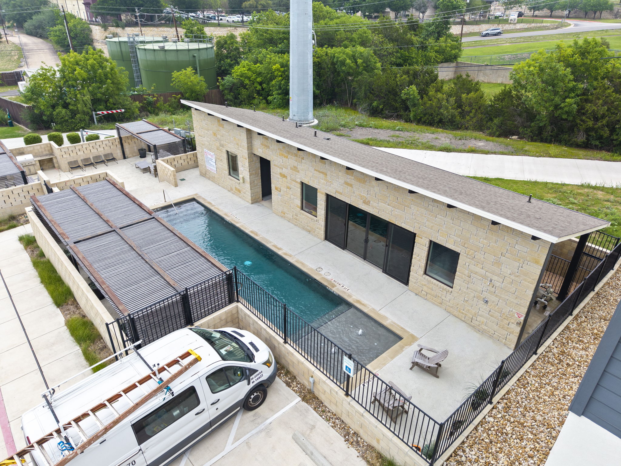 2050 Lohmans Spur Road, Unit 2005 Lakeway, TX 78734 - Photo 21 of 36 The amenity center features a private pool, outdoor kitchen, lounge areas, and gym.
