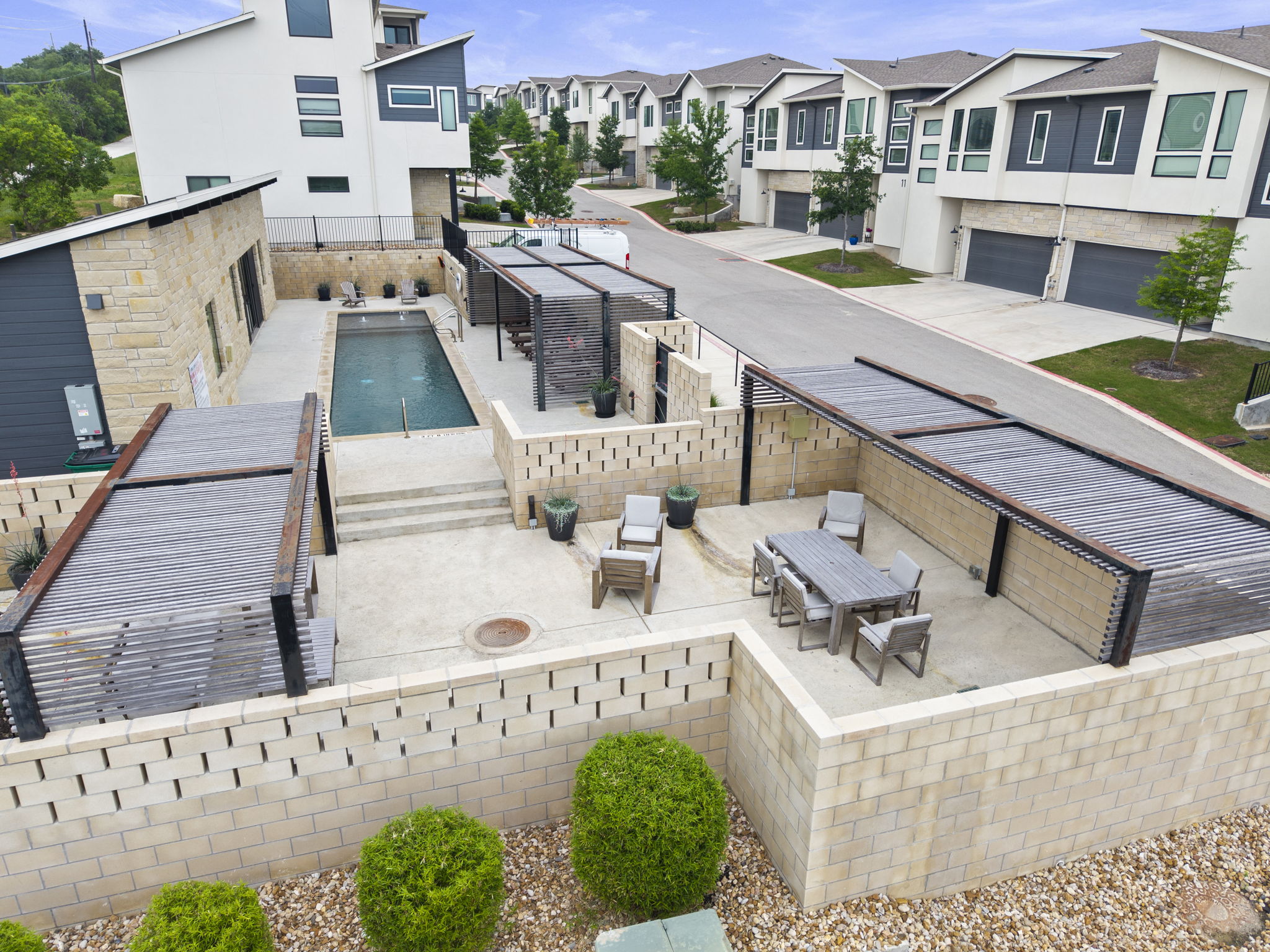 2050 Lohmans Spur Road, Unit 2005 Lakeway, TX 78734 - Photo 22 of 36 The amenity center features a private pool, outdoor kitchen, lounge areas, and gym.