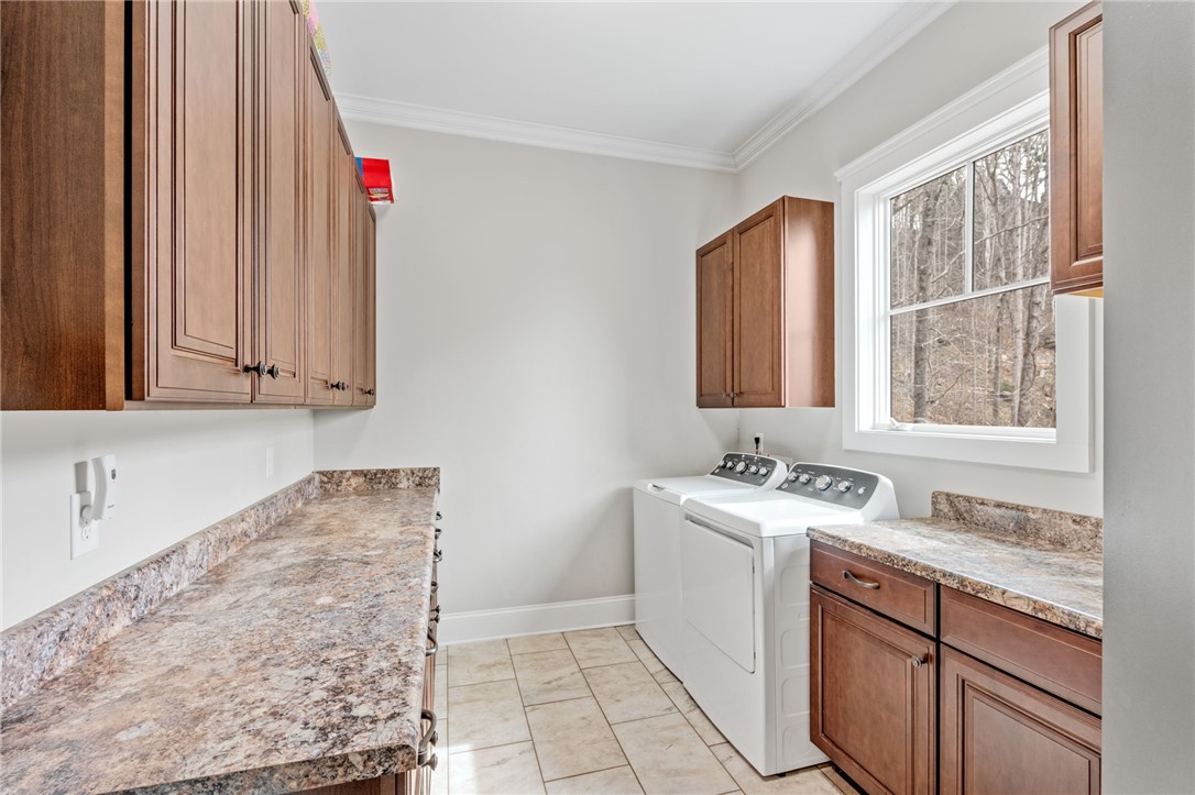 827 Top Ridge Drive Sunset, SC 29685 - Photo 23 of 44 Functional laundry room offers practical storage solutions and ample space for everyday tasks.