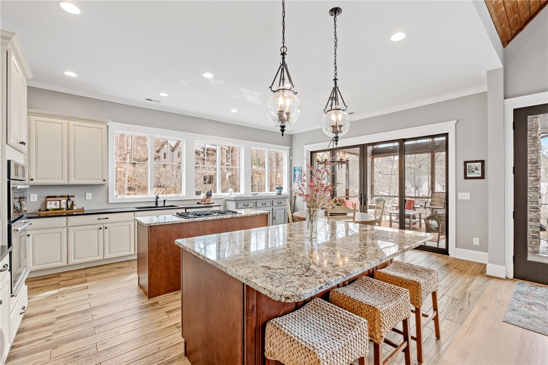 827 Top Ridge Drive Sunset, SC 29685 - Photo 10 of 44 This spacious kitchen features ample counter space and offers direct access to an outdoor living area.
