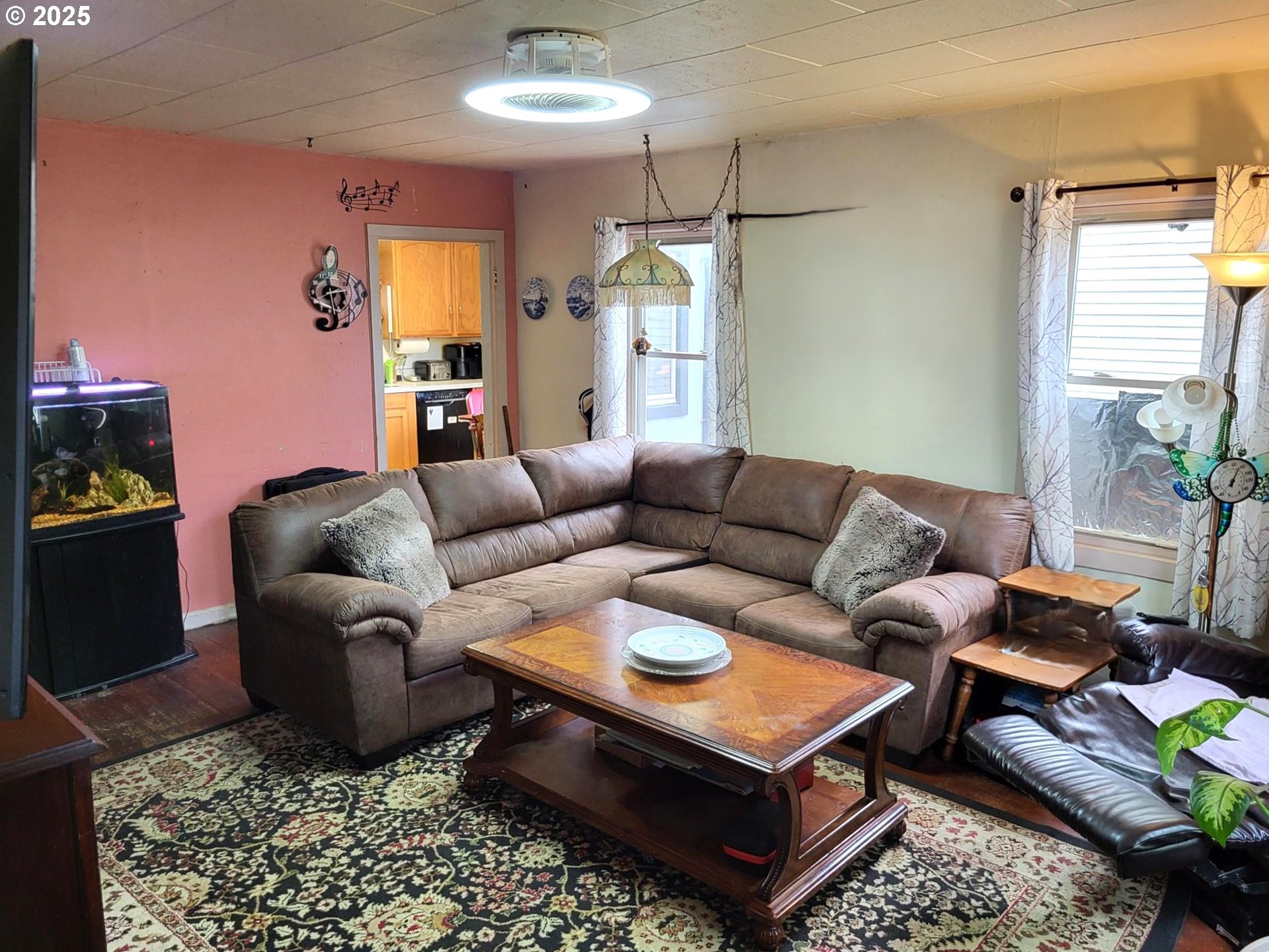 634 East Main Street Sheridan, OR 97378 - Photo 3 of 30 a living room with furniture a chandelier and a rug