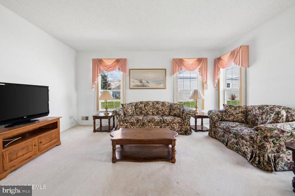 84 Chain Boulevard Bayville, NJ 08721 - Photo 13 of 39 a living room with furniture and a flat screen tv