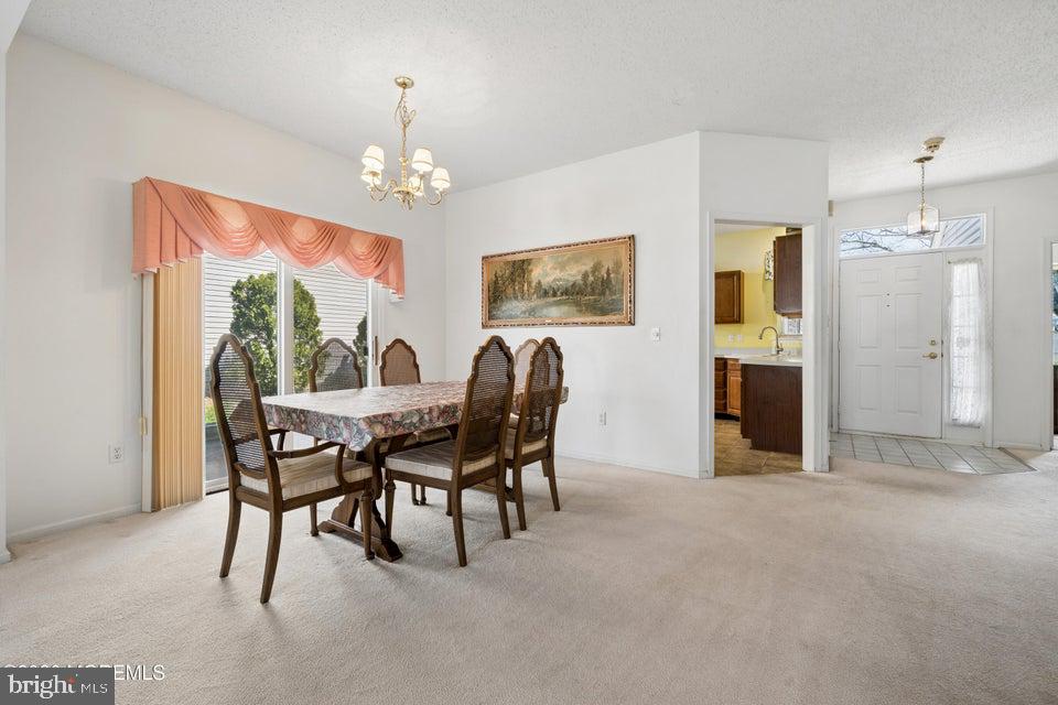 84 Chain Boulevard Bayville, NJ 08721 - Photo 17 of 39 a view of a dining room with furniture window and outside view