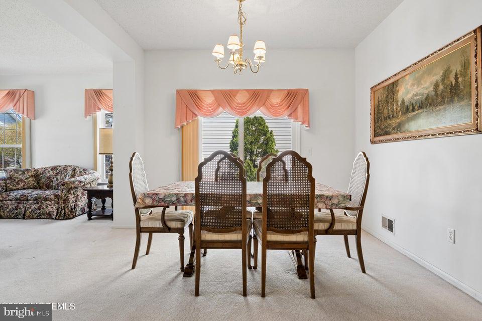 84 Chain Boulevard Bayville, NJ 08721 - Photo 18 of 39 a view of a dining room with furniture window and outside view
