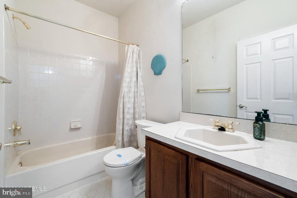 84 Chain Boulevard Bayville, NJ 08721 - Photo 19 of 39 a bathroom with a sink a toilet and shower