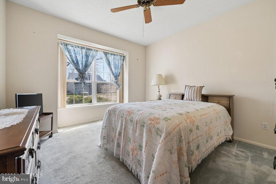 84 Chain Boulevard Bayville, NJ 08721 - Photo 20 of 39 a spacious bedroom with a bed and a desk