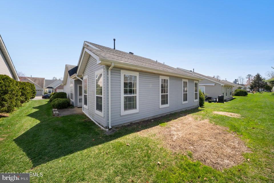 84 Chain Boulevard Bayville, NJ 08721 - Photo 26 of 39 a view of a house with backyard and garden