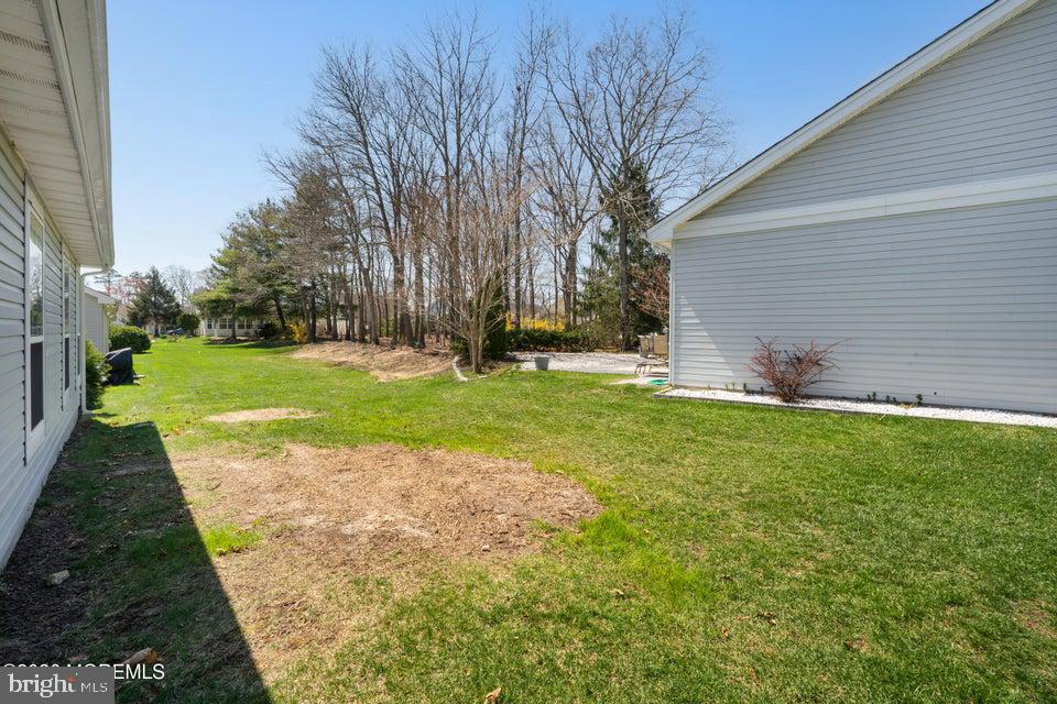 84 Chain Boulevard Bayville, NJ 08721 - Photo 27 of 39 a backyard of a house with lots of green space