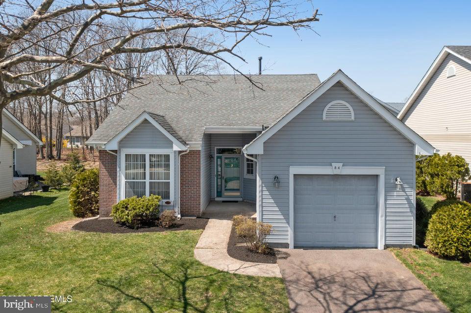 84 Chain Boulevard Bayville, NJ 08721 - Photo 29 of 39 a front view of a house with garden