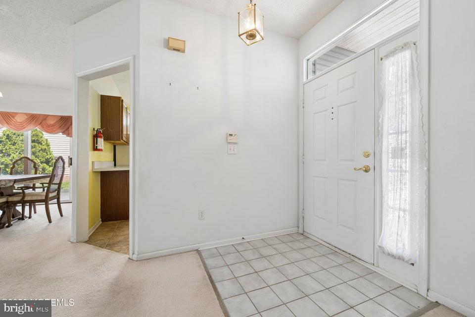 84 Chain Boulevard Bayville, NJ 08721 - Photo 3 of 39 a view of a livingroom with furniture and entryway