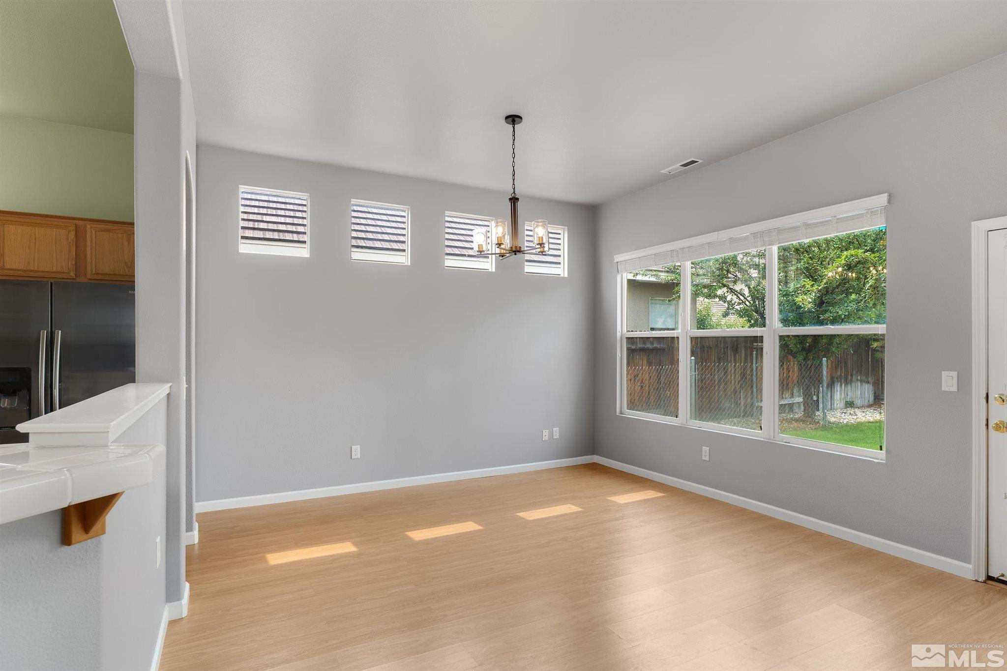 9649 Shadowstone Way Reno, NV 89521 - Photo 5 of 20 a view of an empty room with a window