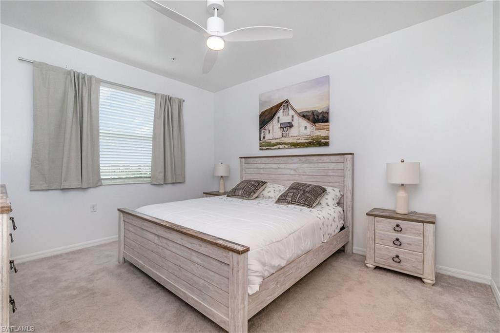 43989 Boardwalk Loop, Unit 2043 Babcock Ranch, FL 33982 - Photo 16 of 45 a bedroom with a bed and a window