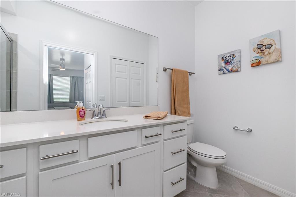43989 Boardwalk Loop, Unit 2043 Babcock Ranch, FL 33982 - Photo 21 of 45 a bathroom with a toilet sink and mirror
