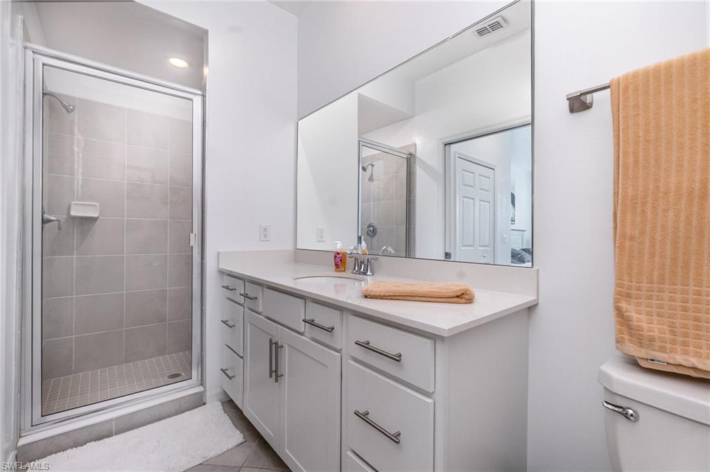 43989 Boardwalk Loop, Unit 2043 Babcock Ranch, FL 33982 - Photo 22 of 45 a bathroom with a sink and a mirror