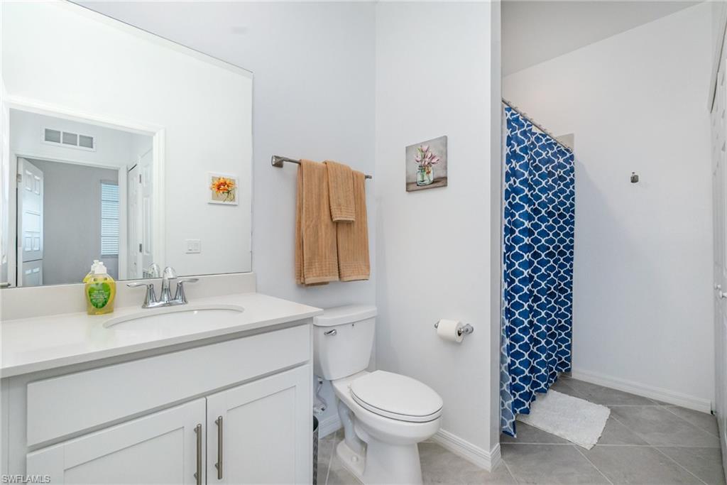 43989 Boardwalk Loop, Unit 2043 Babcock Ranch, FL 33982 - Photo 25 of 45 a bathroom with a sink toilet and shower